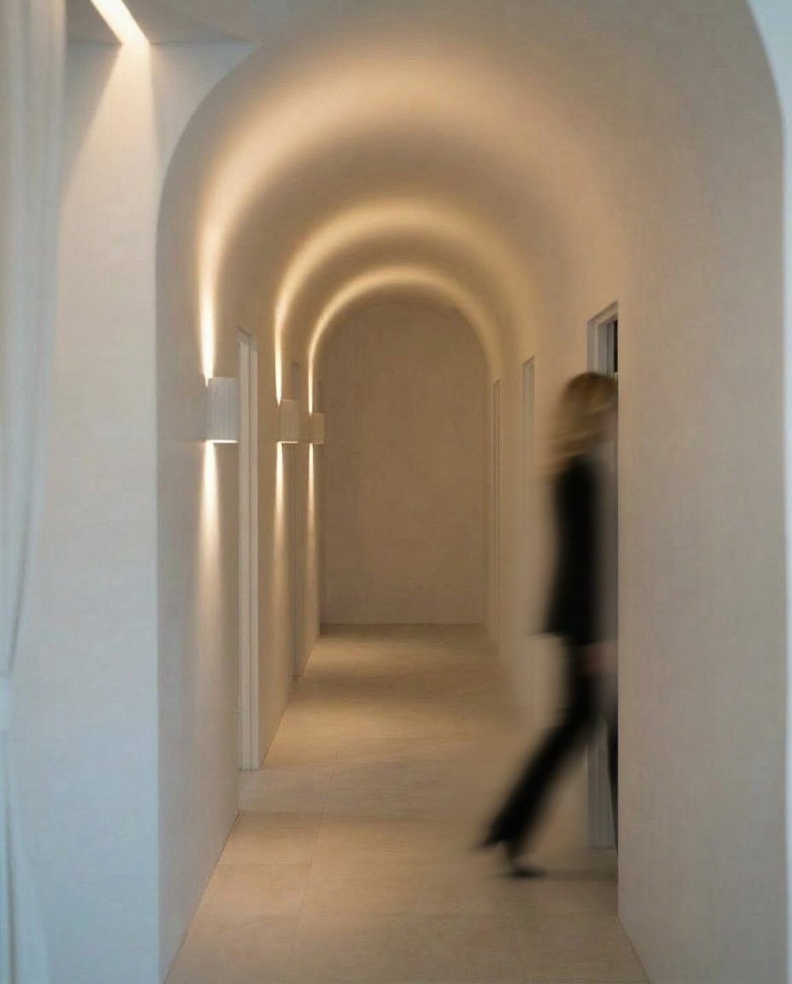 Skin Forum Burleigh Waters clinic hallway with soft lighting and arched interior